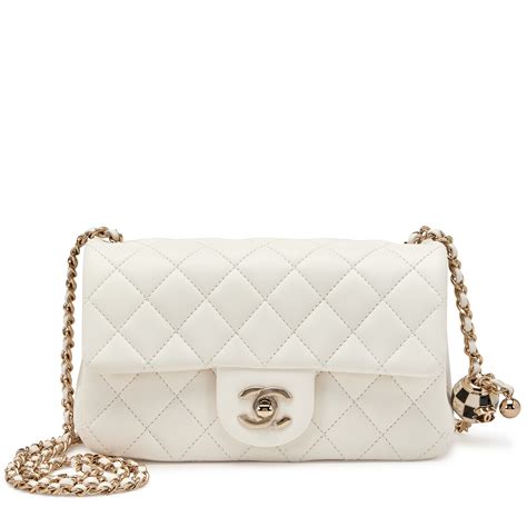 white pearl crush chanel|Chanel mini flap bag with top handle.